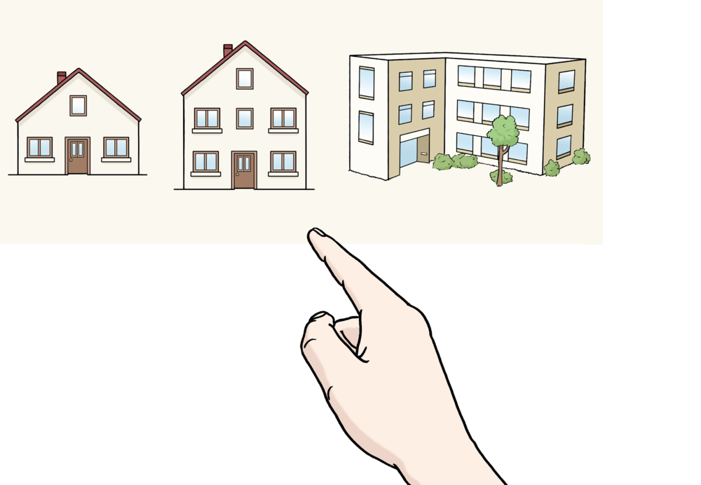 Eine Hand zeigt auf ein Haus